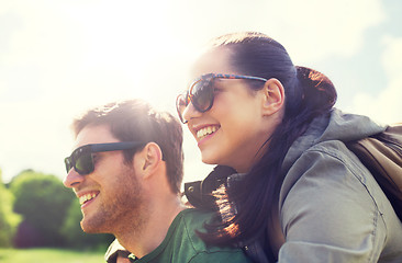 Image showing happy couple with backpacks having fun outdoors