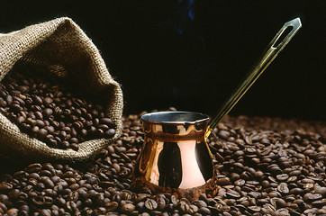 Image showing A Turkish coffee pot with beans