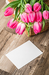 Image showing Beautiful bouquet of pink tulips and congratulations on the table