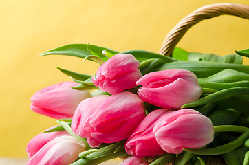 Image showing Beautiful bouquet of pink tulips in a wicker basket