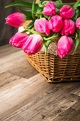 Image showing Beautiful bouquet from pink tulips  on a table