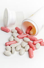 Image showing Pills and capsules in a jar on a white background