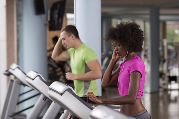 Image showing people exercisinng a cardio on treadmill