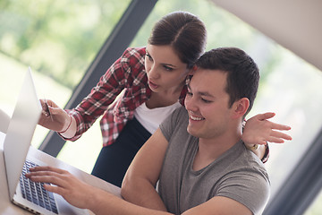 Image showing happy young couple buying online