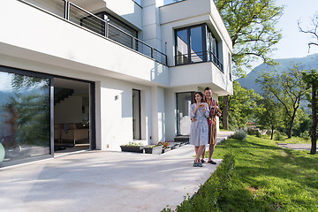 Image showing Young beautiful couple in bathrobes