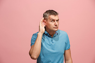 Image showing The happy business man standing and young man listening