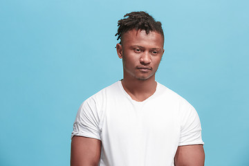 Image showing Beautiful afro-american man looking suprised and bewildered isolated on pink