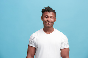 Image showing The squint eyed afro-american man with weird expression isolated on pink