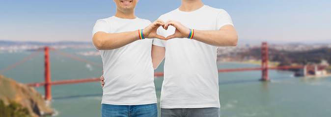 Image showing couple with gay pride rainbow wristbands and heart