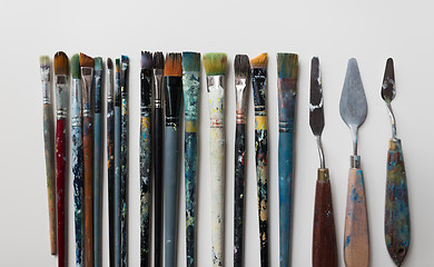Image showing palette knives or painting spatulas and brushes