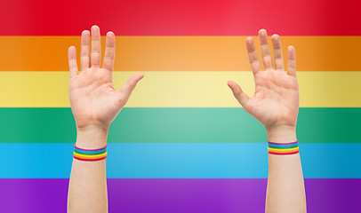 Image showing hands with gay pride rainbow wristbands