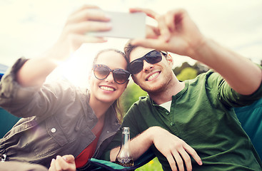 Image showing couple of travelers taking selfie by smartphone