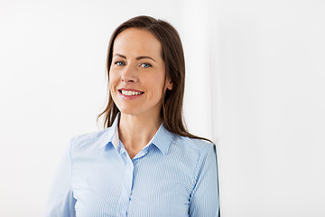 Image showing happy smiling middle aged woman at office