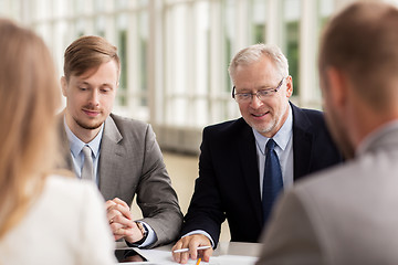 Image showing smiling business people meeting in office