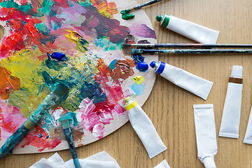 Image showing palette, brushes and paint tubes on table