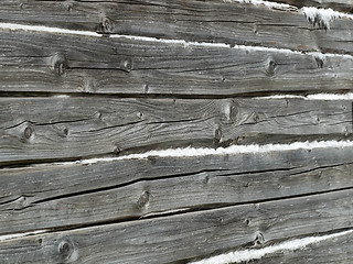 Image showing Old wooden wall of hewn natural logs