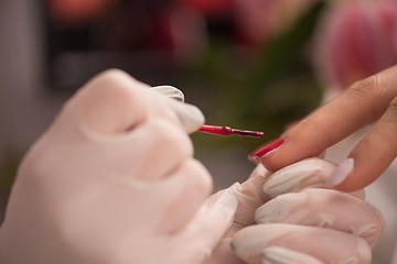 Image showing Woman hands receiving a manicure