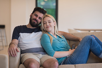 Image showing young happy couple relaxes in the living room