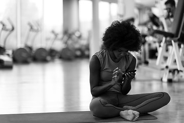 Image showing african american woman exercise yoga in gym