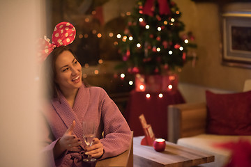 Image showing woman drinking champagne at spa