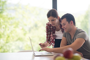 Image showing happy young couple buying online