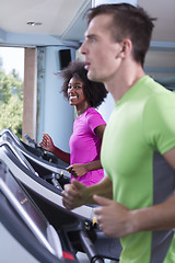 Image showing people exercisinng a cardio on treadmill in gym