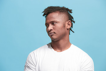 Image showing Beautiful bored faro-american man bored isolated on blue background