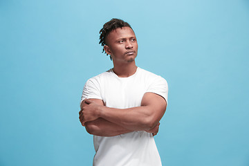 Image showing Young serious thoughtful Afro-American businessman. Doubt concept.