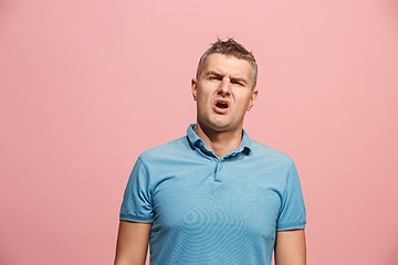 Image showing Beautiful bored man bored isolated on pink background