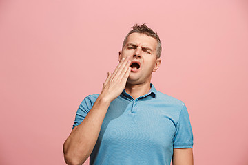 Image showing Beautiful bored man bored isolated on pink background