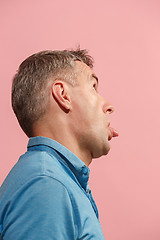 Image showing The squint eyed man with weird expression isolated on pink