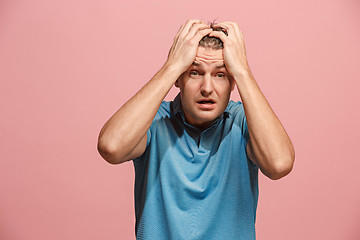 Image showing Handsome man in stress isolated on pink