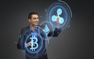 Image showing businessman with cryptocurrency holograms