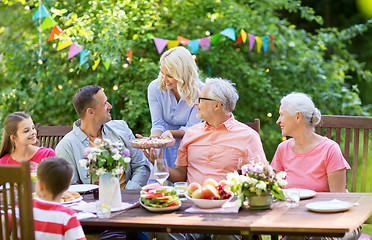 Image showing happy family having dinner or summer garden party