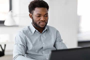 Image showing african american businessman with laptop at office