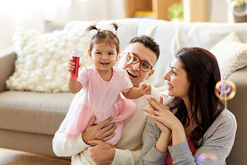 Image showing family with soap bubbles playing at home