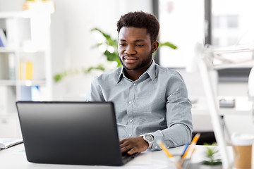 Image showing african american businessman with laptop at office