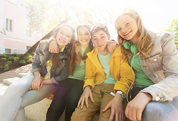 Image showing happy teenage students or friends hugging