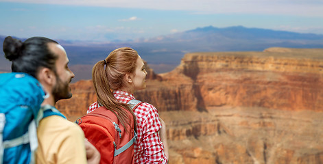 Image showing couple with backpacks over grand canyon