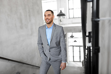 Image showing businessman walking upstairs