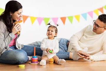 Image showing baby girl with parents playing with toys