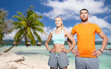 Image showing happy couple exercising at summer