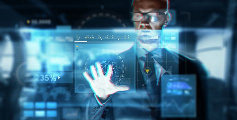 Image showing close up of businessman touching virtual screen