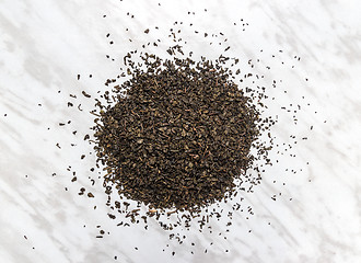 Image showing Green tea leaves on marble background