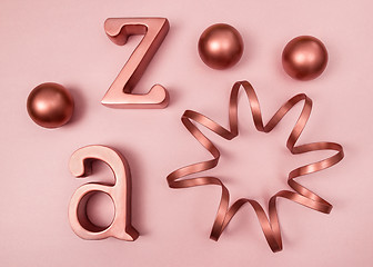 Image showing Copper decorative objects on pink background