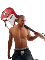 Image showing Young black man with bass guitar over shoulder