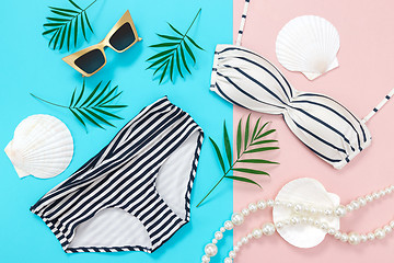 Image showing Summer holidays flat lay on blue and pink background