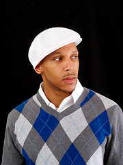 Image showing Young black man in sweater and white cap