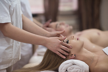 Image showing couple enjoying head massage at the spa