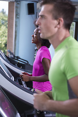 Image showing people exercisinng a cardio on treadmill in gym